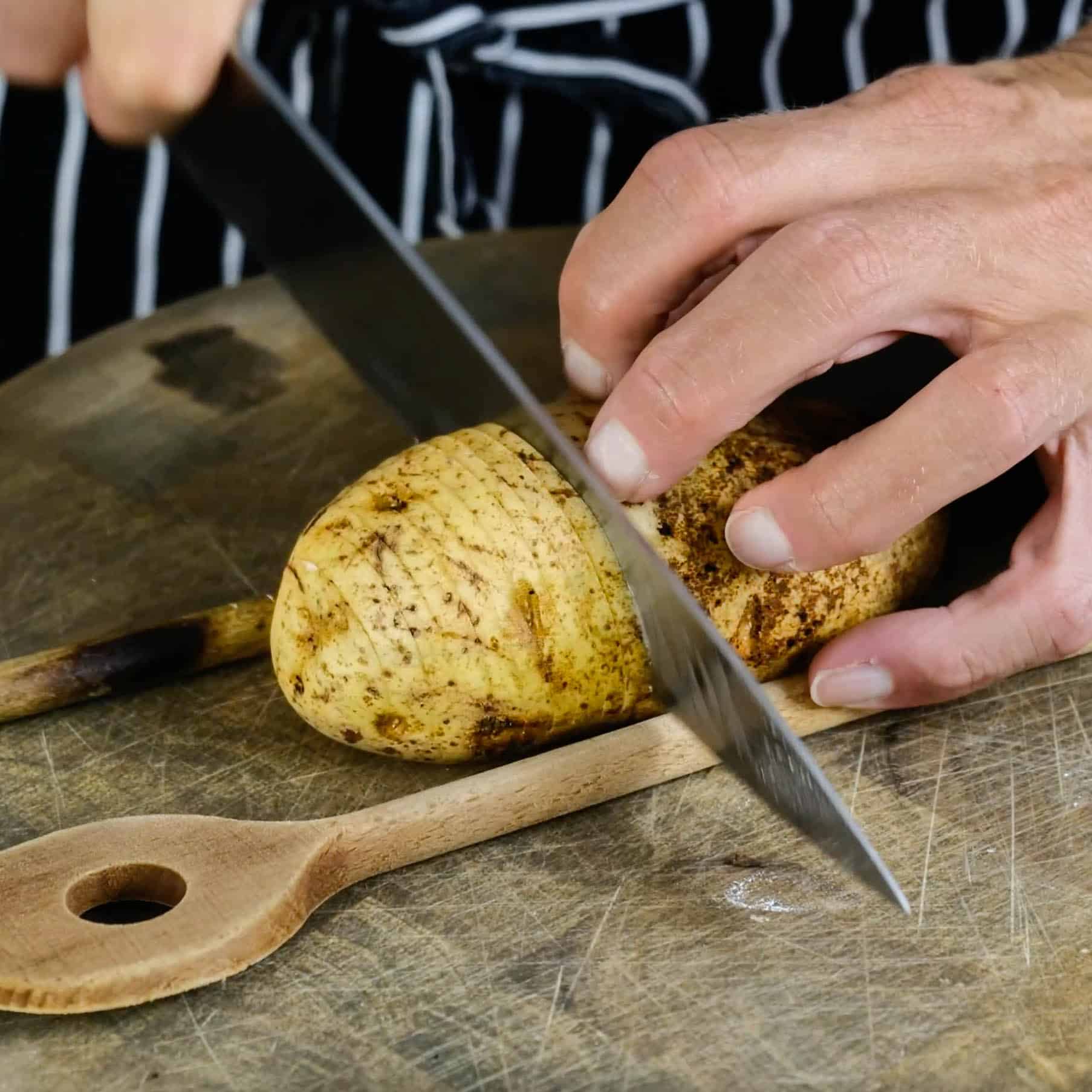 cutting potato for hasselback potato