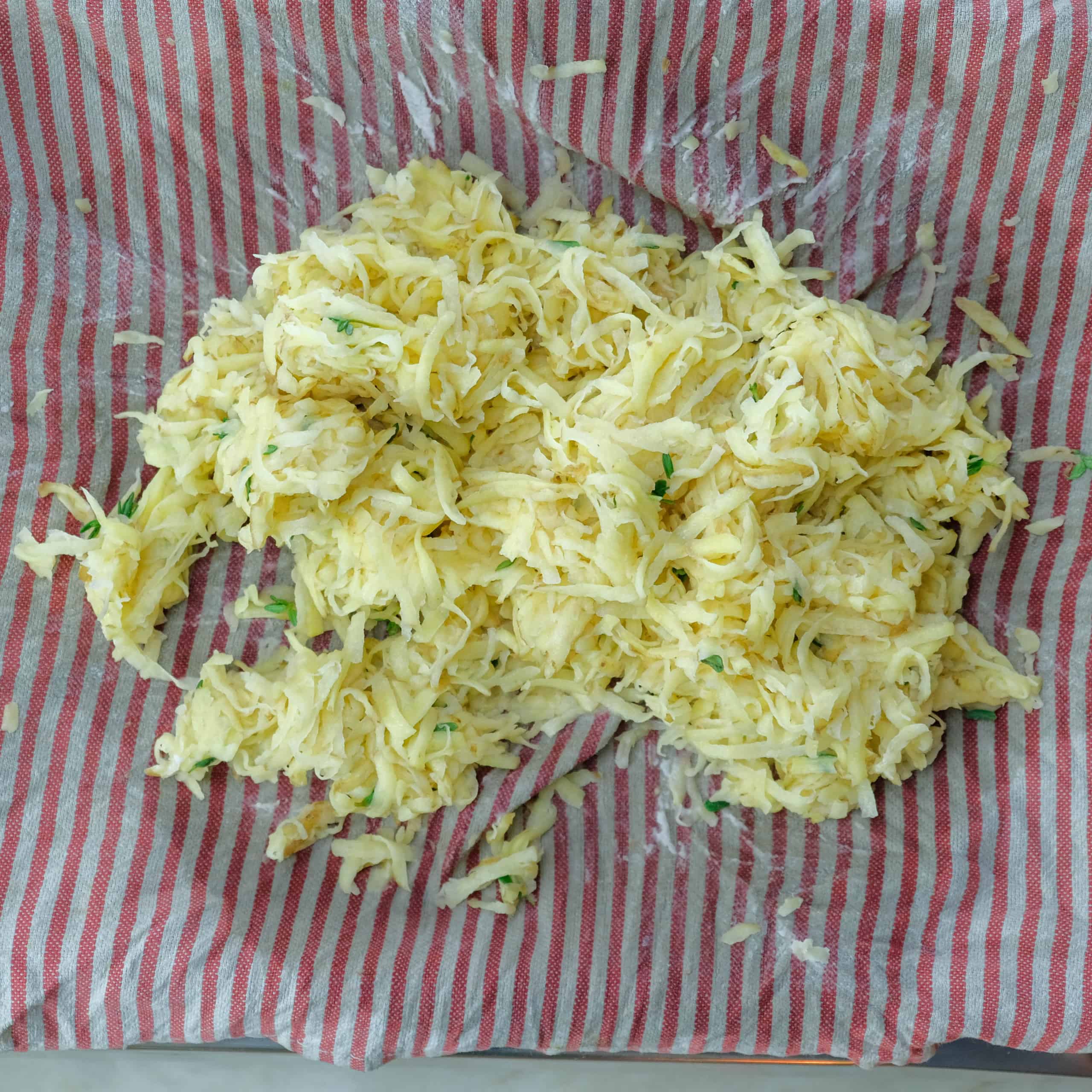 SHREDDED POTATOES, PRESSED, SEASONED WITH THYME FOR ROSTI