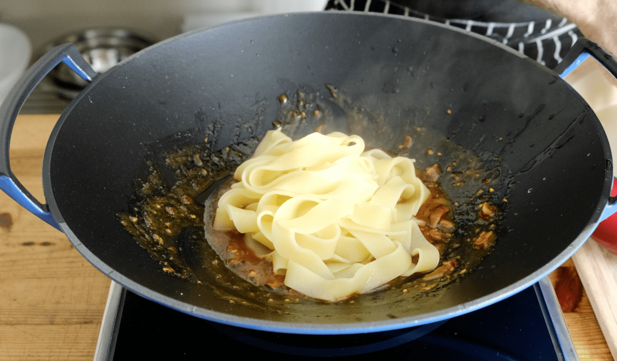 ADDING COOKED PASTA TO SAUCE