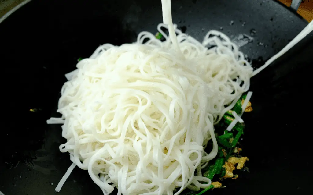 adding noodles to vegan pad thai