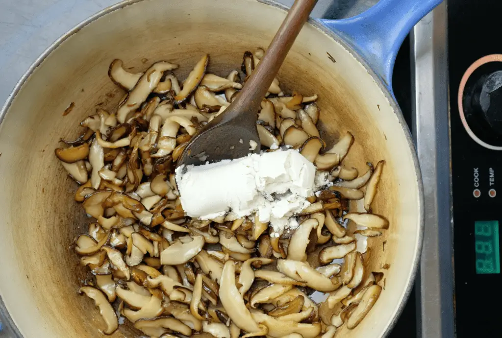 ADDING FLOUR TO SHIITAKE MUSHROOMS