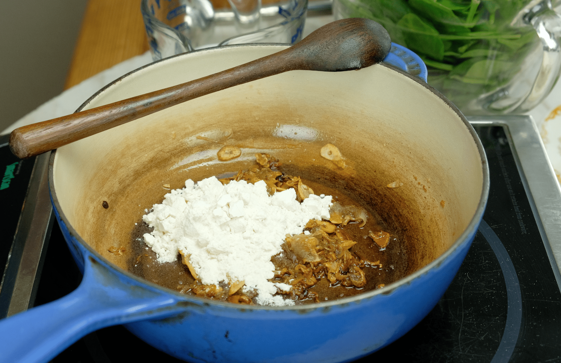 ADDING FLOUR TPO SHALLOT_GARLIC TO MAKE A ROUX ADDING FLOUR TPO SHALLOT_GARLIC TO MAKE A ROUX