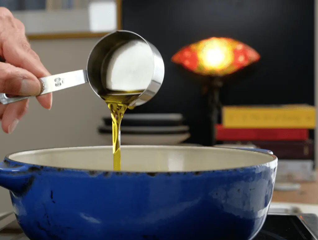 ADDING EXTRA VIRGIN OLIVE OIL TO PAN FOR KELP OIL