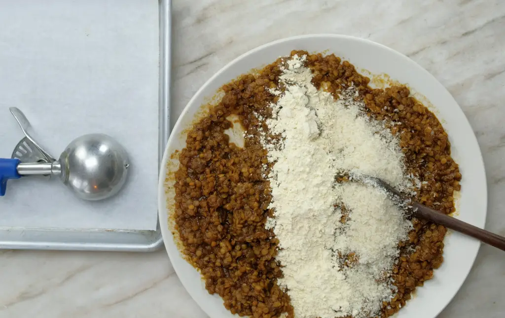 ADDING GARBANZO BEAN FLOUR AND PANKO BREAD CRUMBS TO COOKED LENTILS