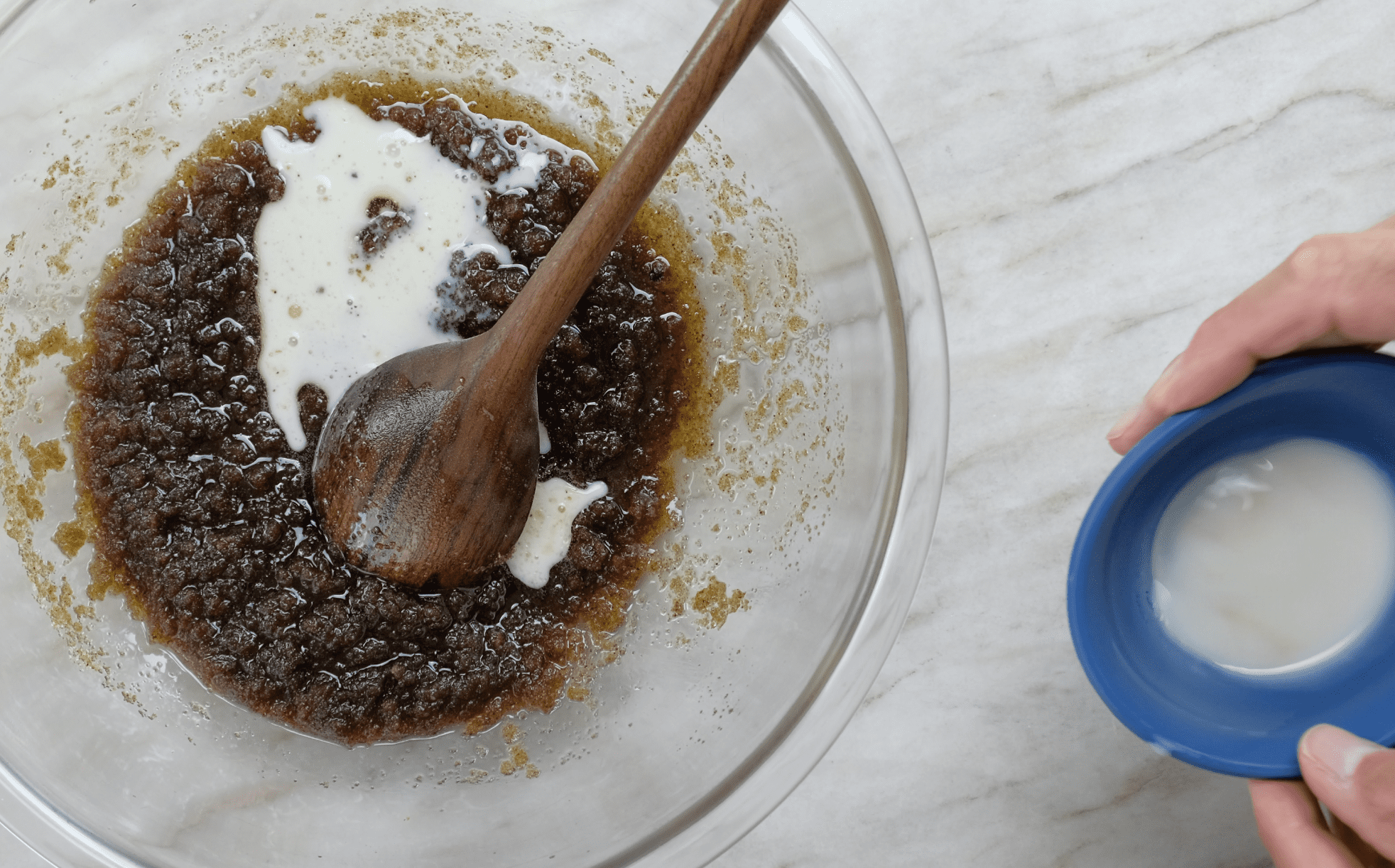 ADDING PLANT MILK TO SUGAR AND MELTED BUTTER FOR TOFFEE CHOCOLATE COOKIES