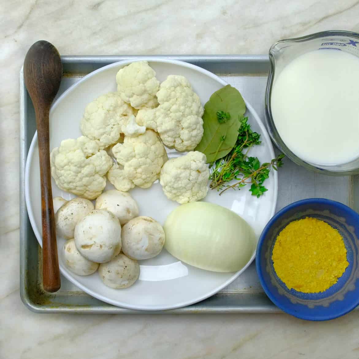 alfredo ingredients , cauliflower, onions, mushrooms, herbs, oat milk