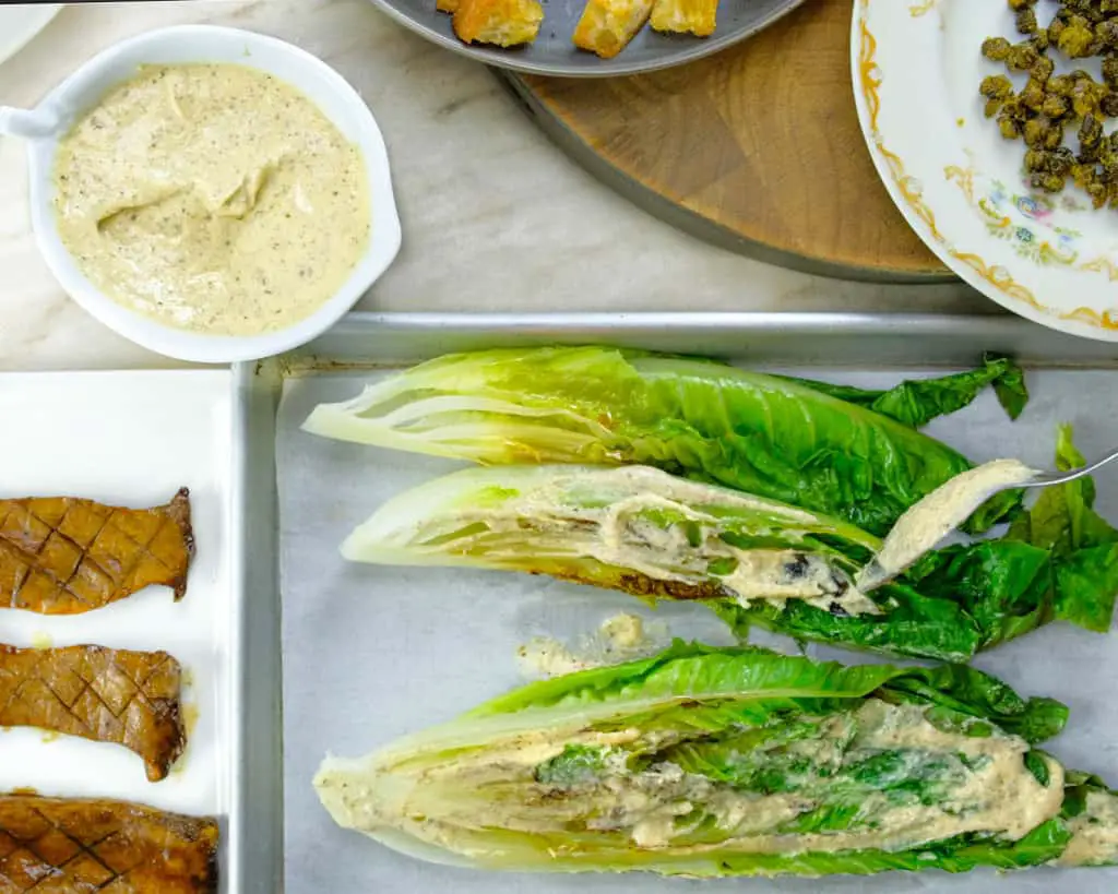 DRESSING ROMAINE LETTUCE WITH CEASAR DRESSING_