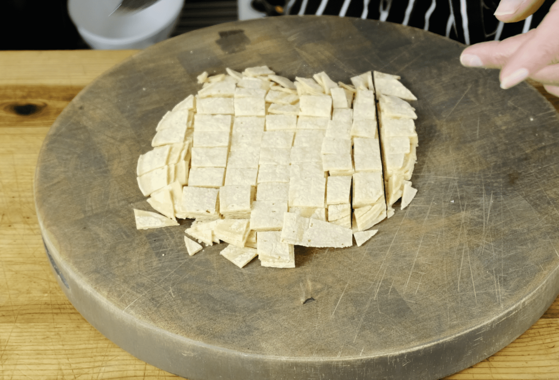 Cut corn tortilla for vegan fritos