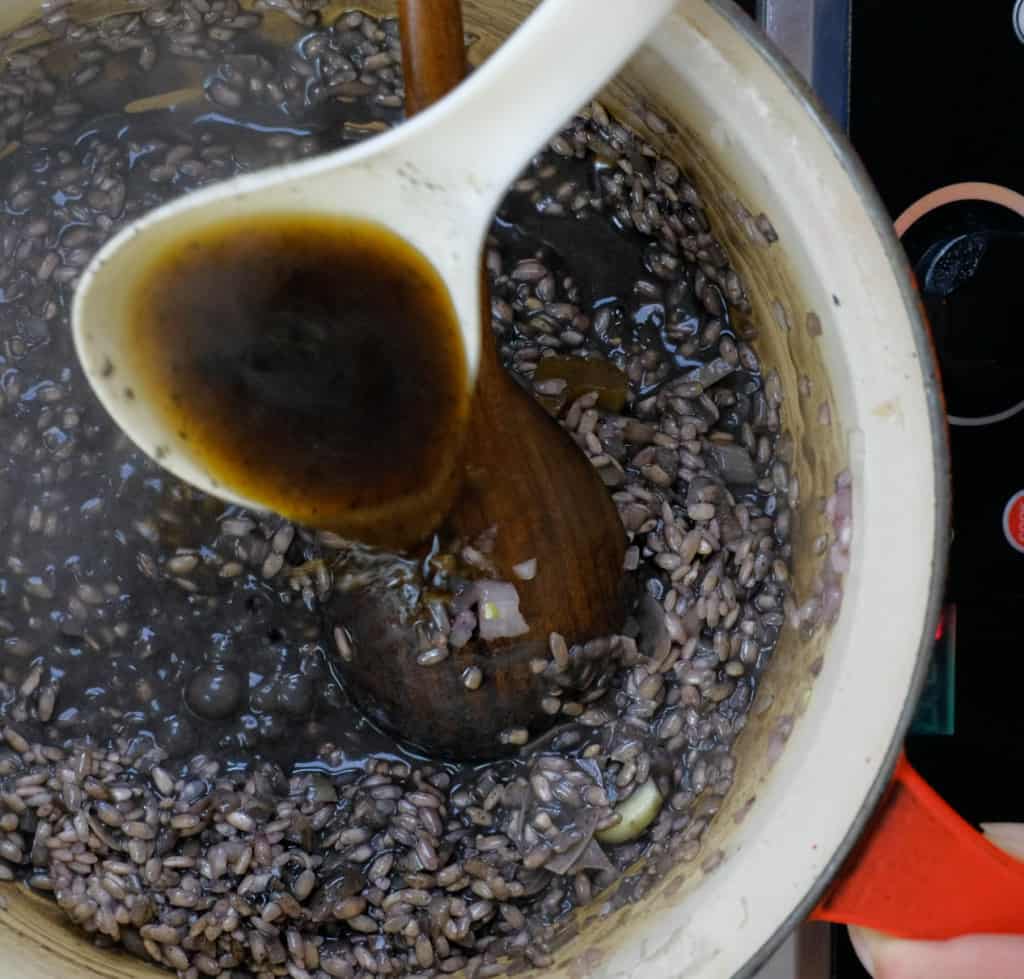 ADDING BLACK SESAME STOCK TO vegan squid ink risotto