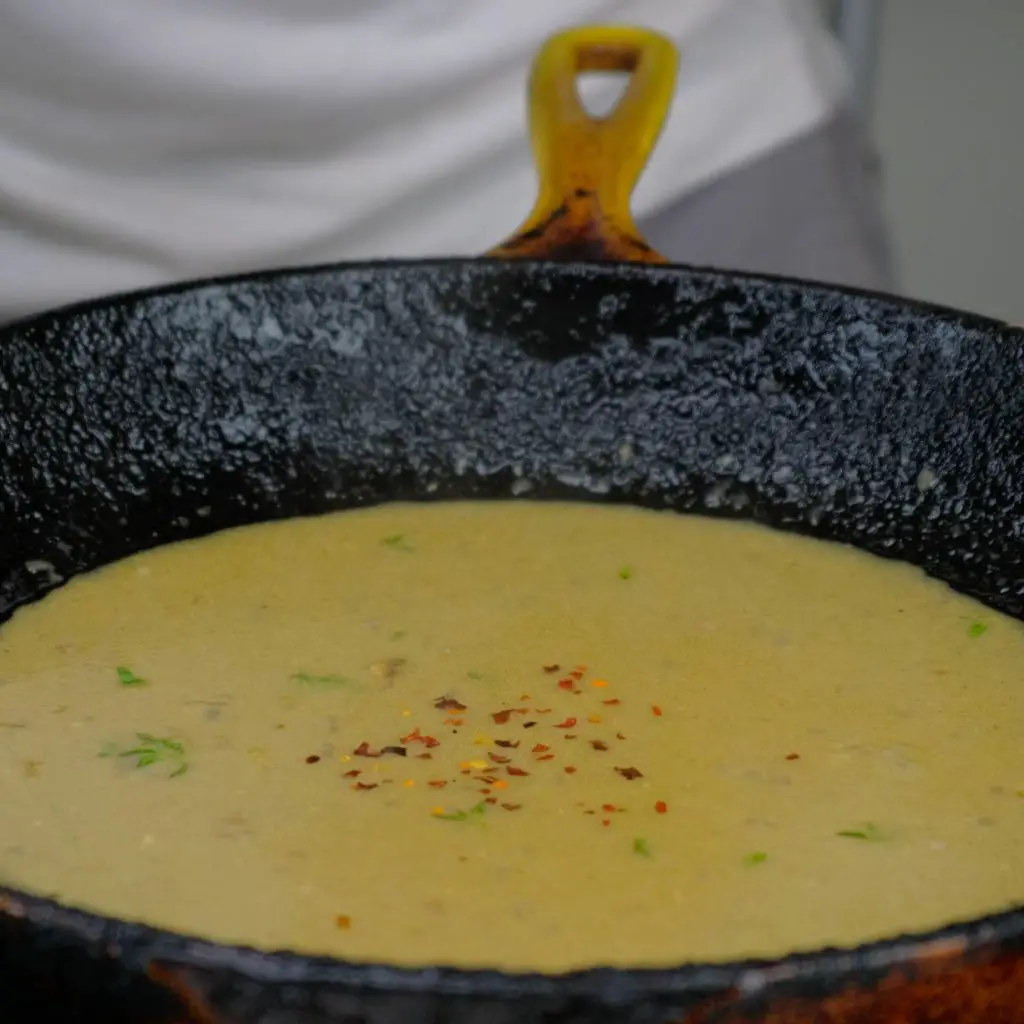 MUSTARD SAUCE COOKING WITH WHITE WINE , RED PEPPER FLAKES