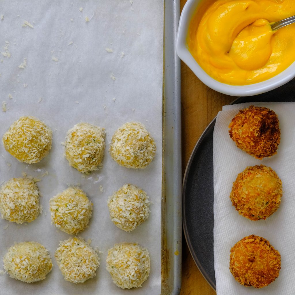 POTATO CROQUETTES, COOKED, AND UNCOOKED WITH SPUCY GINGER CARROT SAUCE