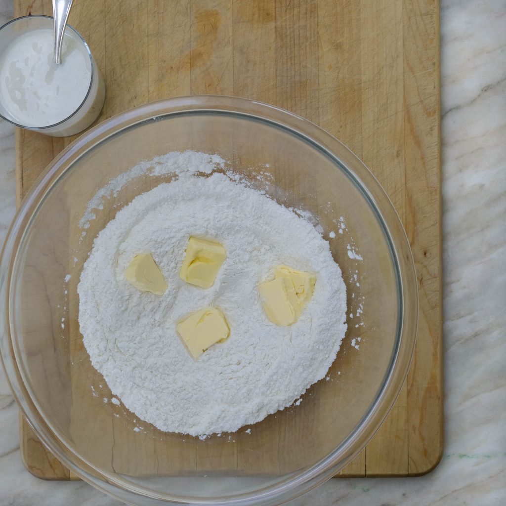 ADDING VEGAN BUTTER TO FLOUR _