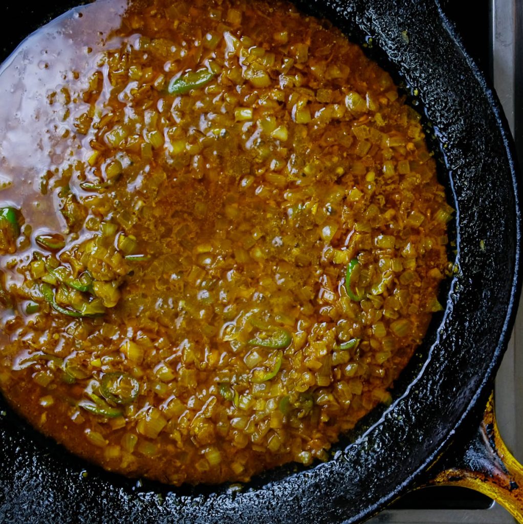 BRAISED SPICES, ONIONS, GARLIC AND SERRANO CHILI FOR VEGAN SHRIMP STIR FRY