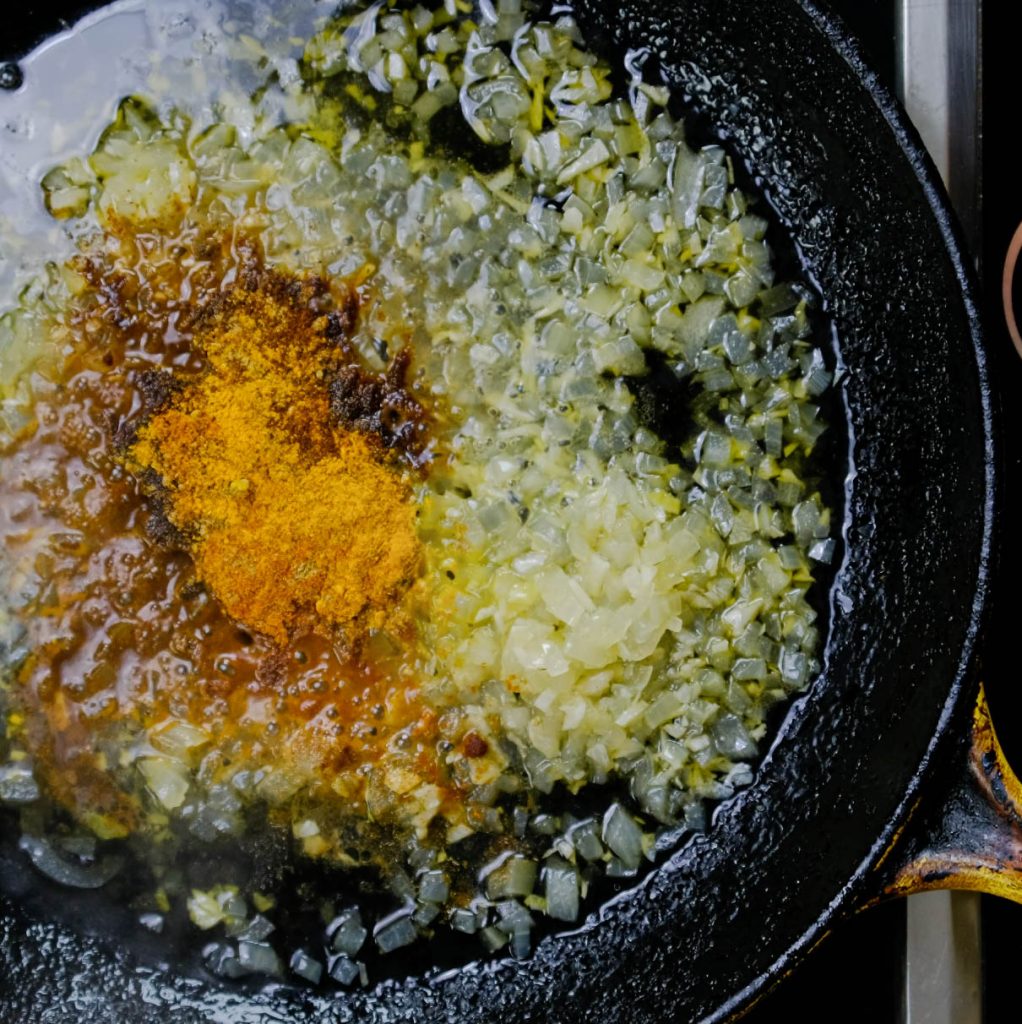 COOKING SPICES, ONIONS, GARLIC AND SERRANO CHILI FOR VEGAN SHRIMP STIR FRY