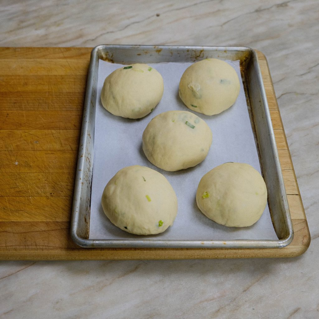 PROOFED FORMED SCALLION BRIOCHE DOUGH