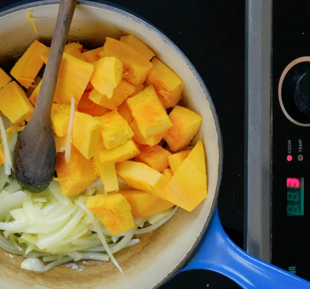 COOKING ONIONS AND PUMPKIN DICE FOR CREAMY PUMPKIN SAUCE